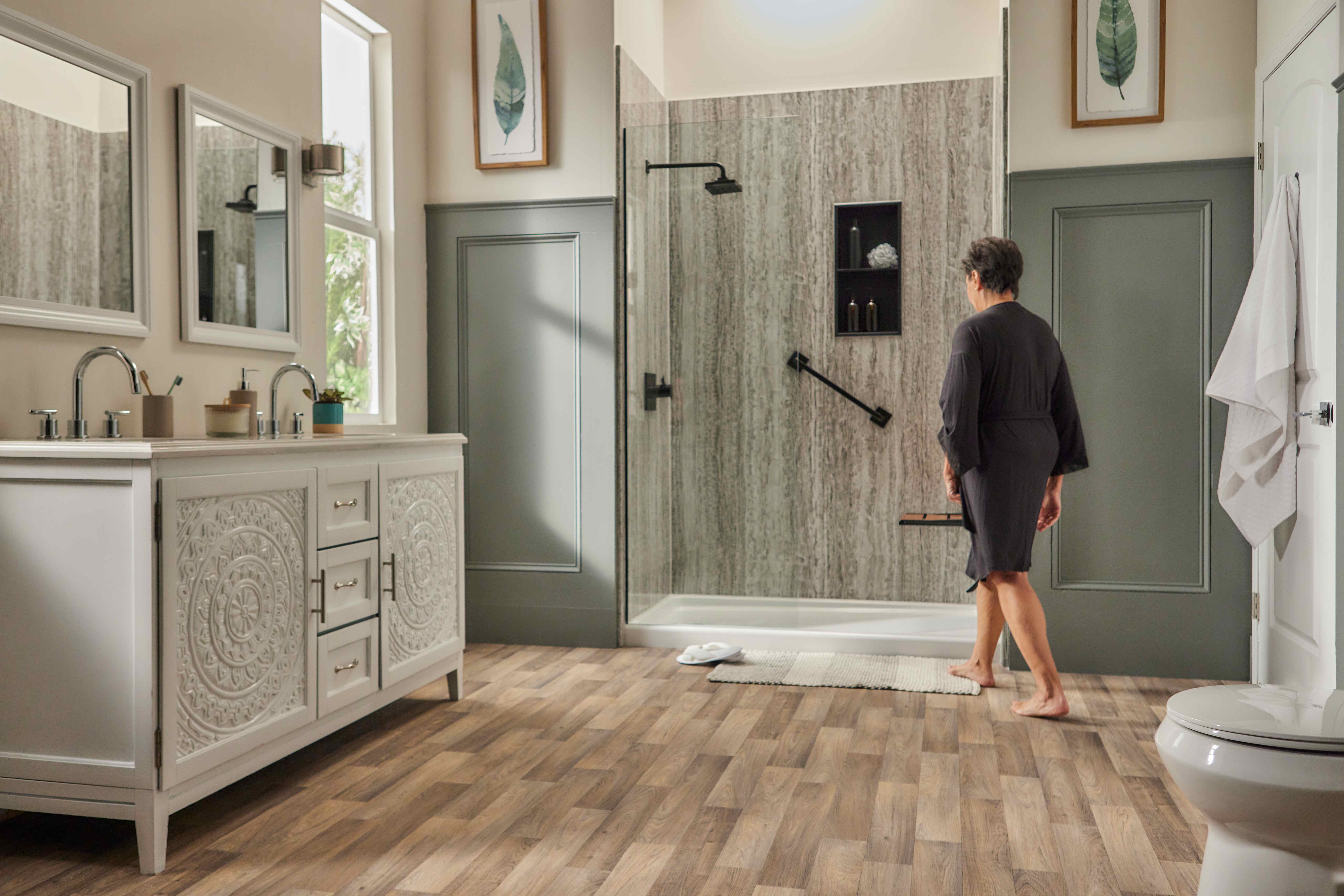 Senior citizen entering a walk-in shower