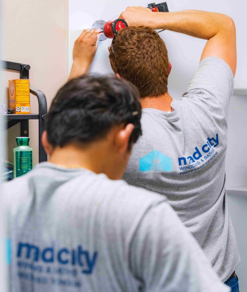 Mad City Windows installers working on a shower remodel